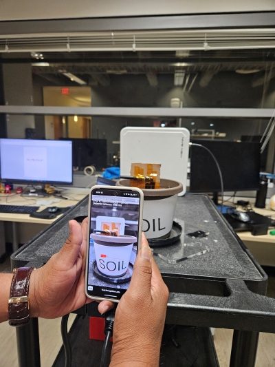 Using a smartphone-based AR app, conference attendees at IEEE RFID 2025 saw in real time how RFID tags could show the amount of force applied or visualize the moisture content in a pot of soil through AR. 